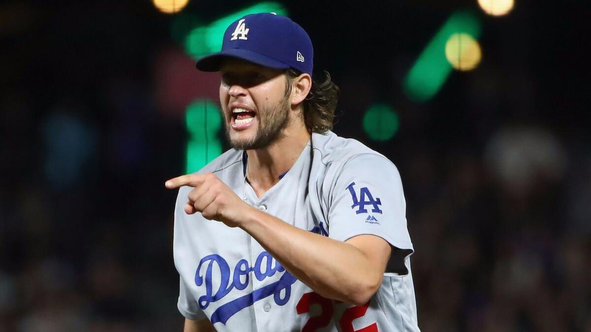 Dodgers ace Clayton Kershaw reacts after striking out San Francisco's Tim Federowicz with the bases loaded during the sixth inning Tuesday.
