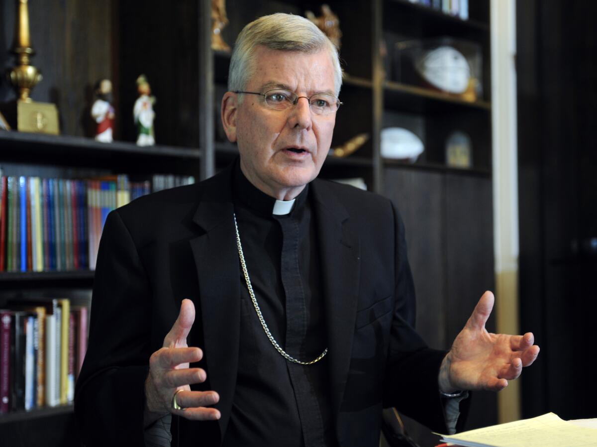 In this July 30, 2014, file photo, St. Paul-Minneapolis Archbishop John Nienstedt speaks at his office in St. Paul, Minn. The archbishop has resigned amid charges that the archdiocese failed to protect children from harm by abusive priests.