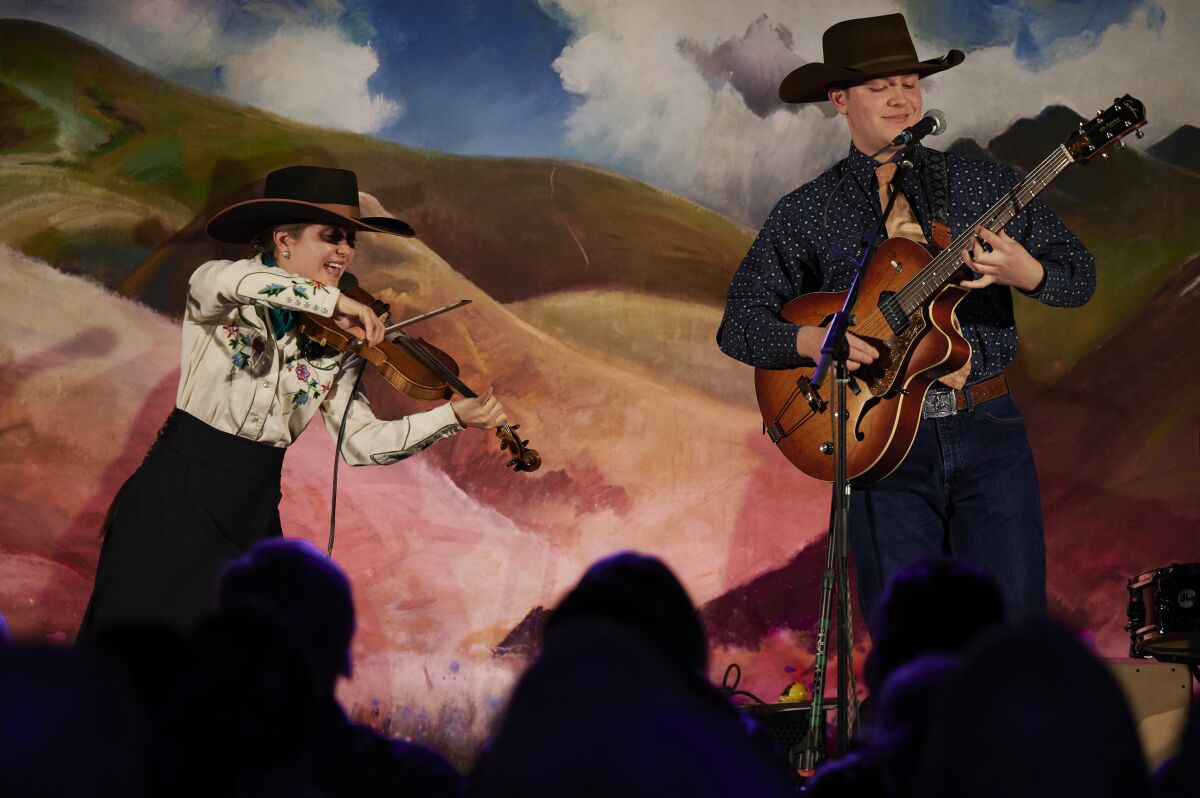 Brigid Reedy and brother Johnny Reedy perform during the National Cowboy Poetry Gathering.