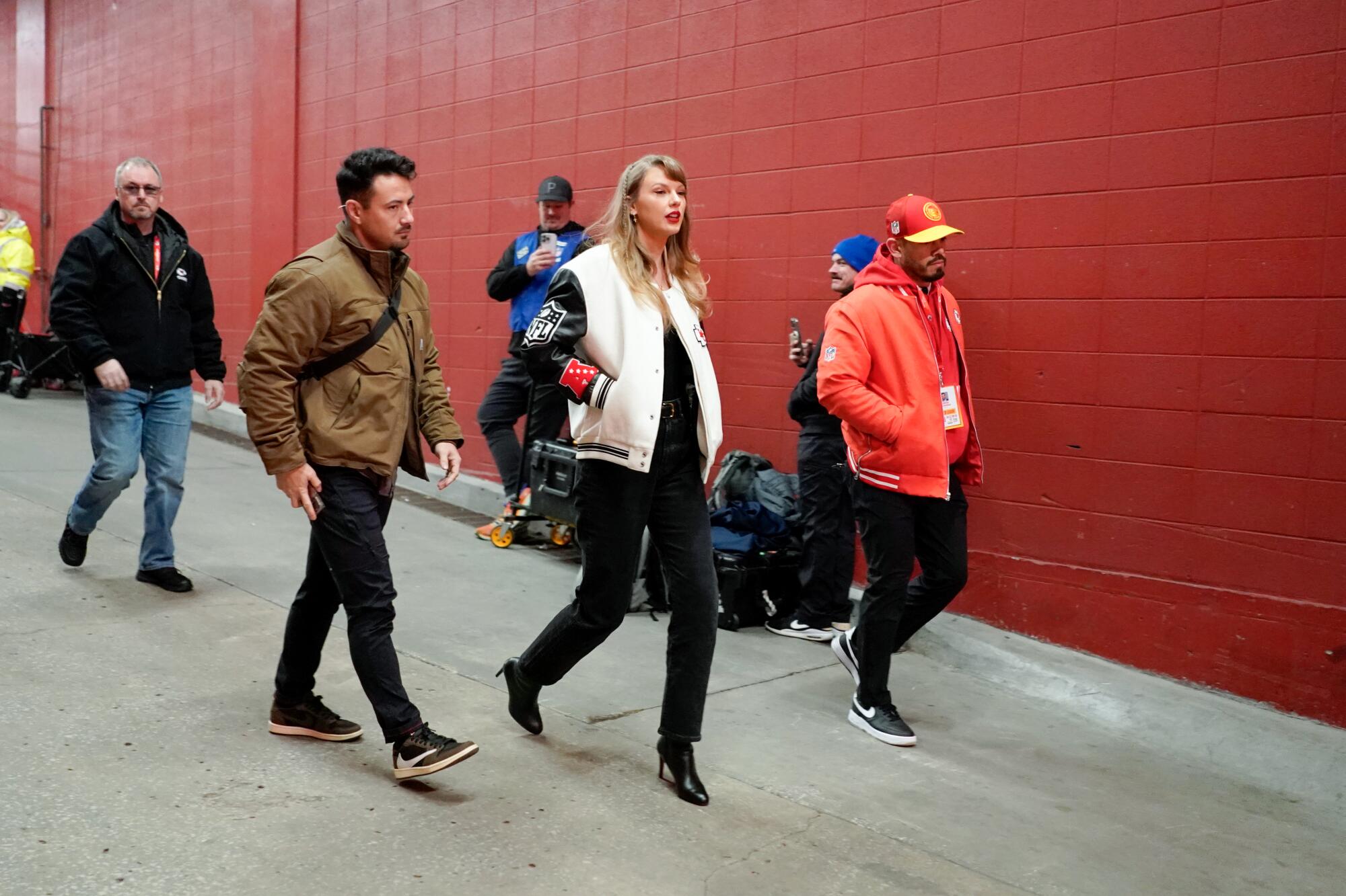 Taylor Swift enters Arrowhead Stadium.