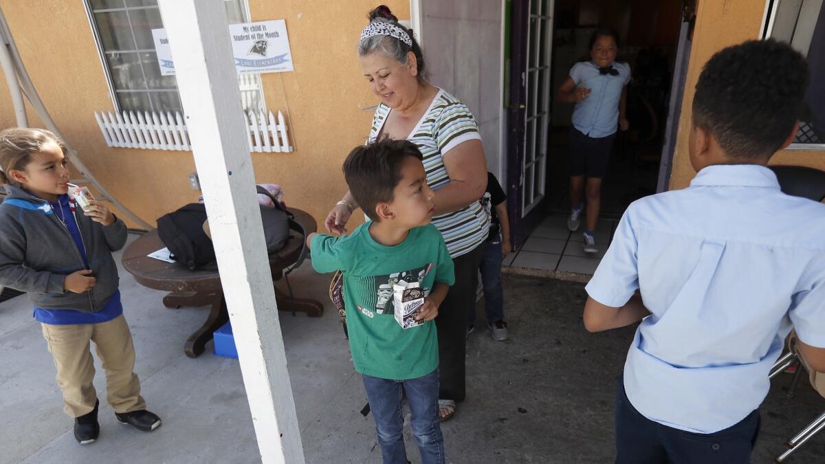 Juana Juaregui welcomes the children who congregate at her East Los Angeles home after school every day.