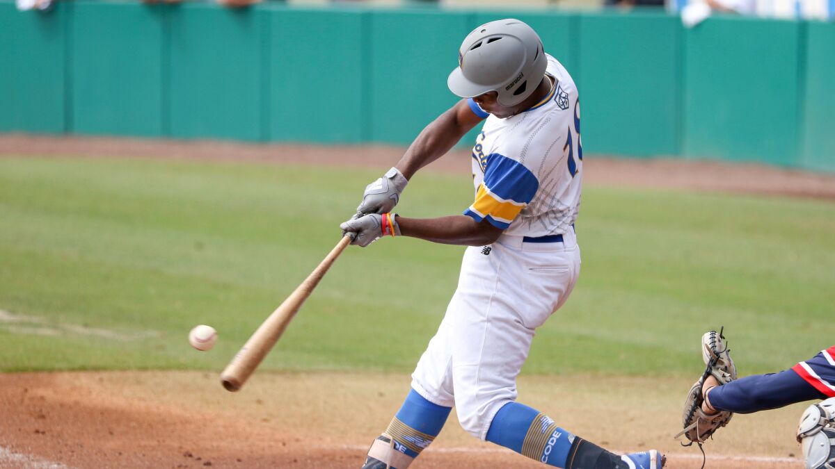 St. John Bosco first baseman Jonathan Vaughns connects on a pitch.