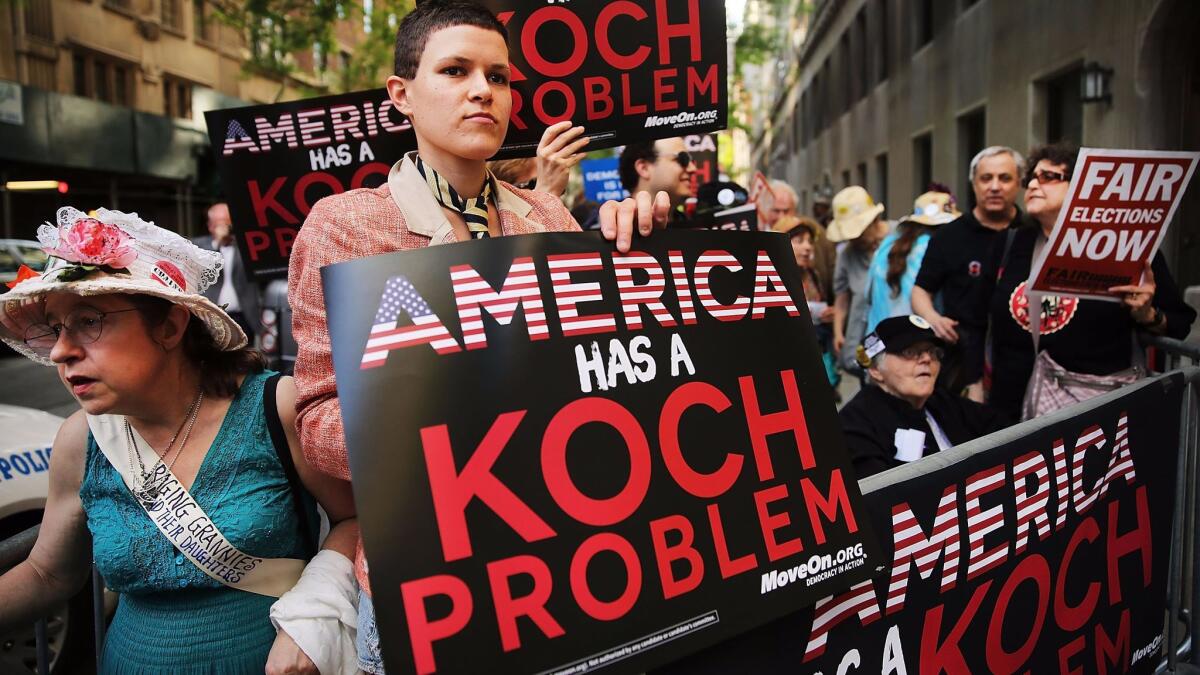 Activists hold a protest near the Manhattan apartment of David Koch on June 5, 2014 in New York City.