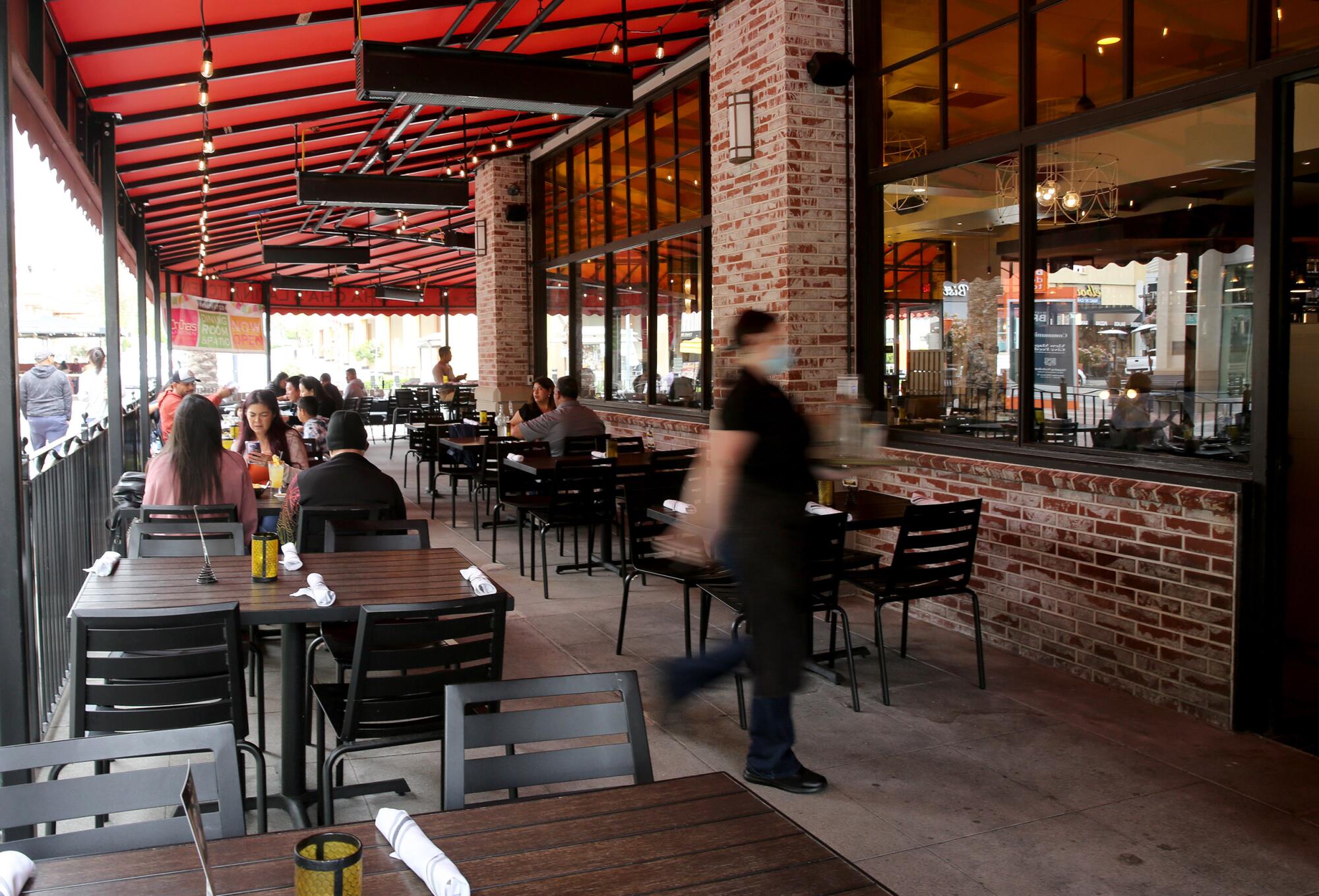 One of the large outdoor dining areas at Cha Cha's Latin Kitchen.