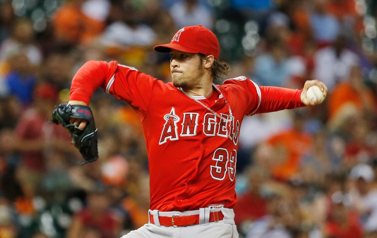 Angels starter C.J. Wilson throws a pitch during the third inning of a game against the Houston Astros on July 28.