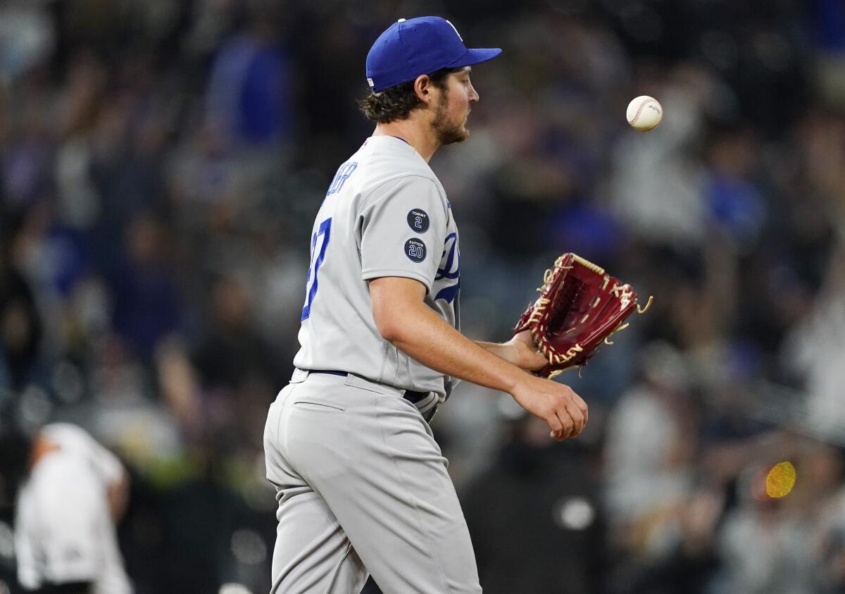 Dodgers pitcher Trevor Bauer reacts after giving up a home run to the Colorado Rockies' Ryan McMahon on April 2, 2021.