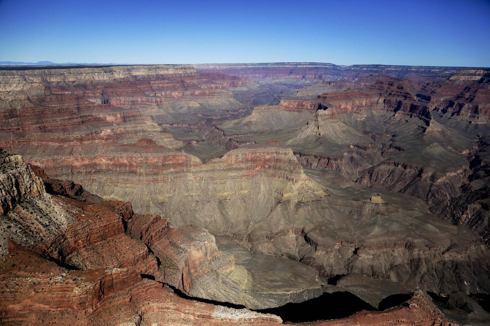 The Grand Canyon National Park is covered in the morning sunlight.