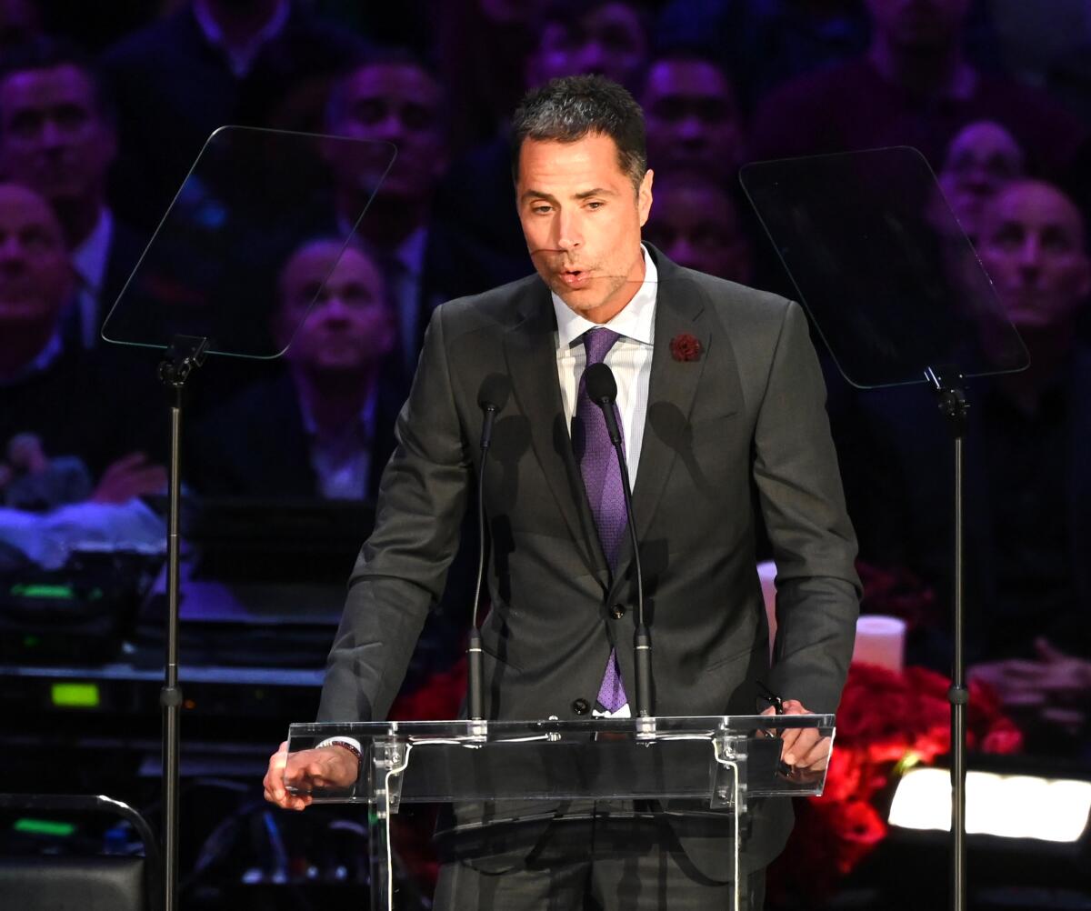 Lakers general manager Rob Pelinka speaks at the Kobe and Gianna Bryant memorial service at Staples Center on Monday.