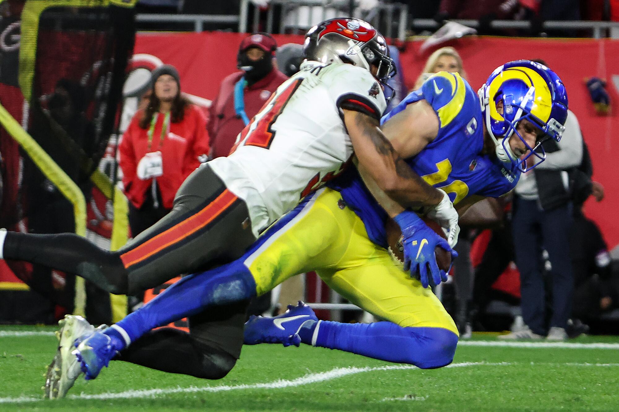 Rams wide receiver Cooper Kupp catches a pass against Buccaneers safety Antoine Winfield Jr.
