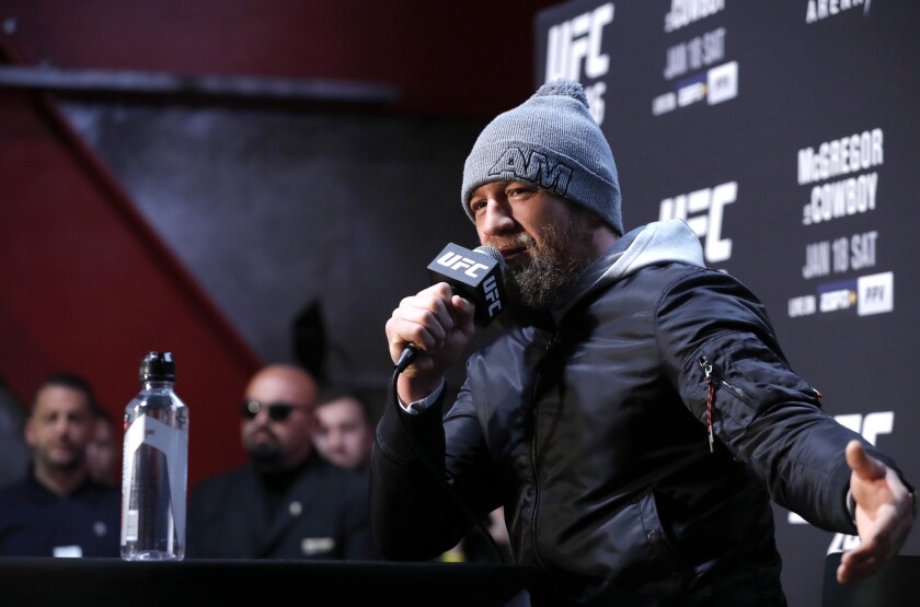 Conor McGregor talks to reporters during UFC 246 media day in Las Vegas.