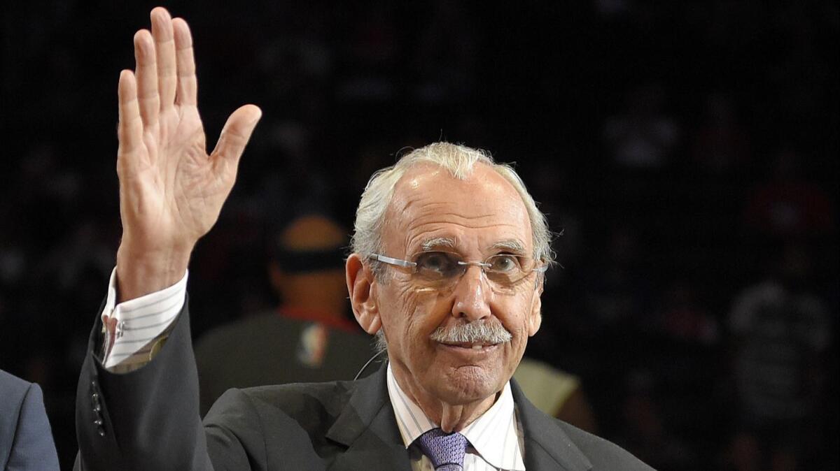Clippers broadcaster Ralph Lawler gives a wave to fans at Staples Center during a halftime ceremony in his honor during the 2016 season.