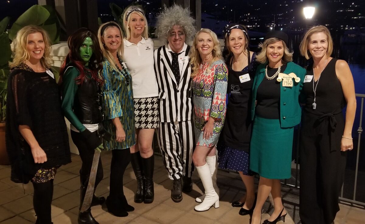 MADCAPS and Beetlejuice pose for a photo.