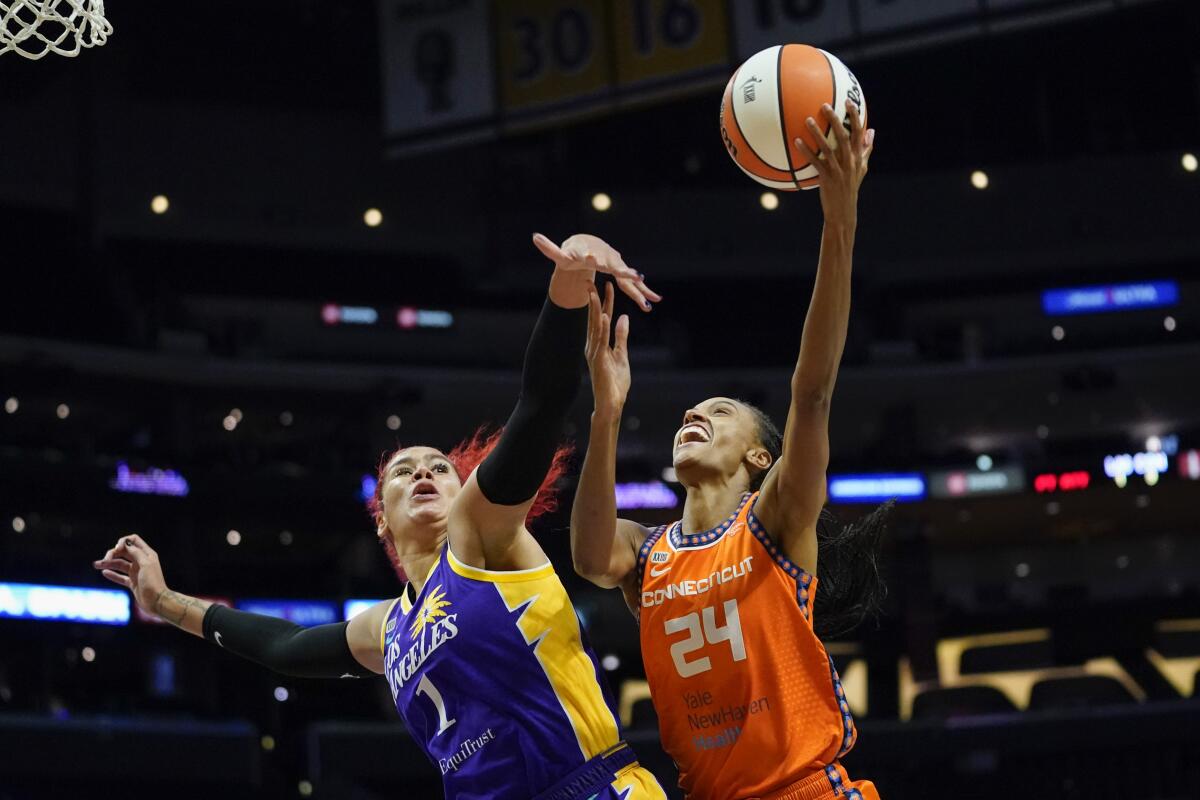 Connecticut Sun forward DeWanna Bonner shoots against Sparks center Amanda Zahui B.