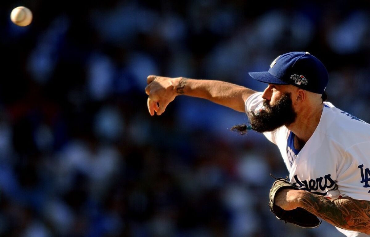 Dodgers reliever Brian Wilson throws against the Cardinals on Oct. 16.