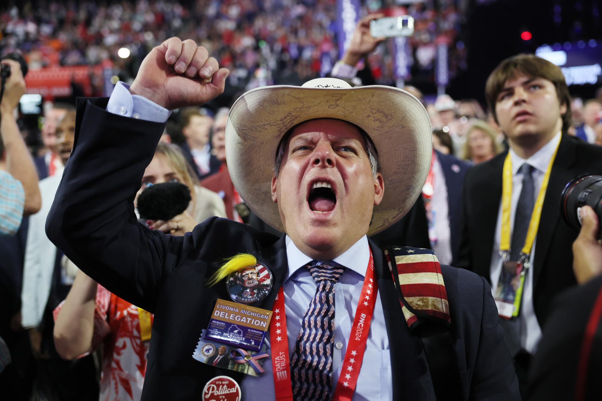 A delegate from Michigan gets fired up on Day One of the Republican National Convention.