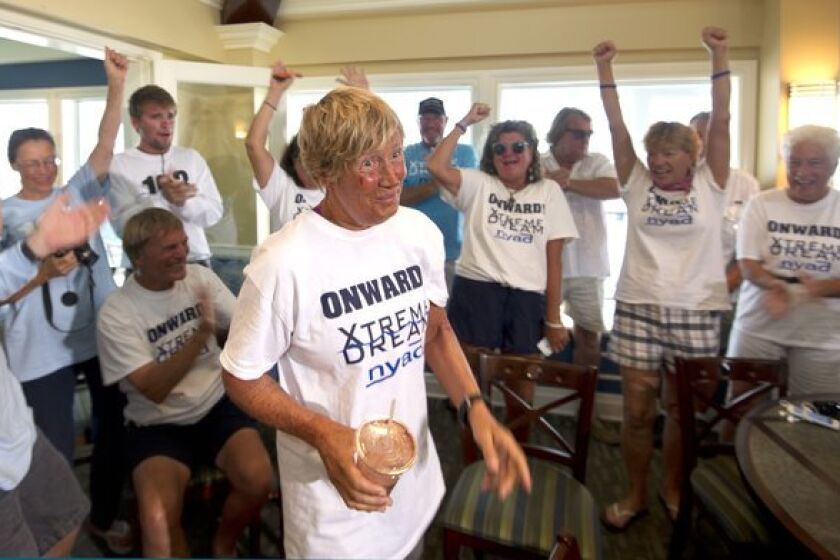 Diana Nyad is cheered on by her crew.