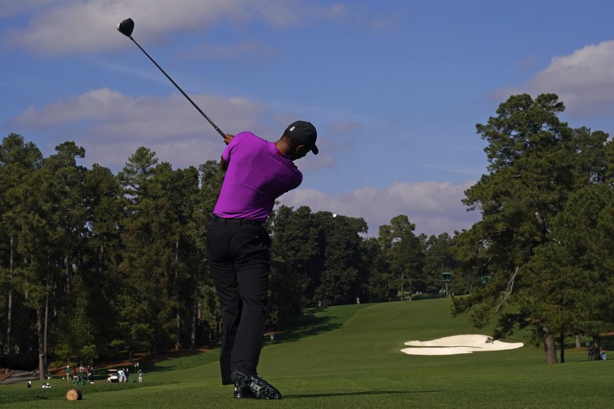 Tiger Woods hits from the eighth tee during the third round of the Masters on Saturday.