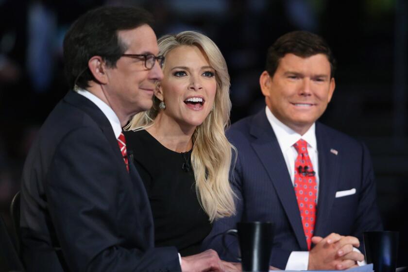 Fox News anchors Chris Wallace, left, Megyn Kelly and Bret Baier moderate the first prime-time Republican presidential debate hosted at the Quicken Loans Arena on Aug. 6, 2015, in Cleveland.