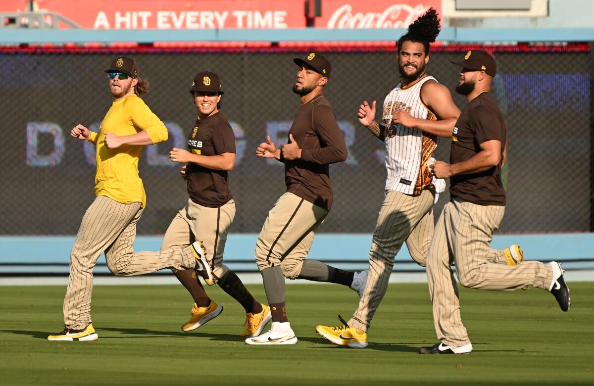 San Diego Padres players work out at Dodger Stadium on Monday.