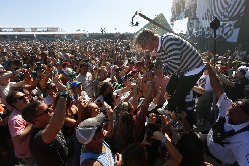 Jon Foreman of the band Switchfoot goes into the crowd at the Sunset Cliffs stage at KAABOO Del Mar on Saturday, Sept. 14, 2019.