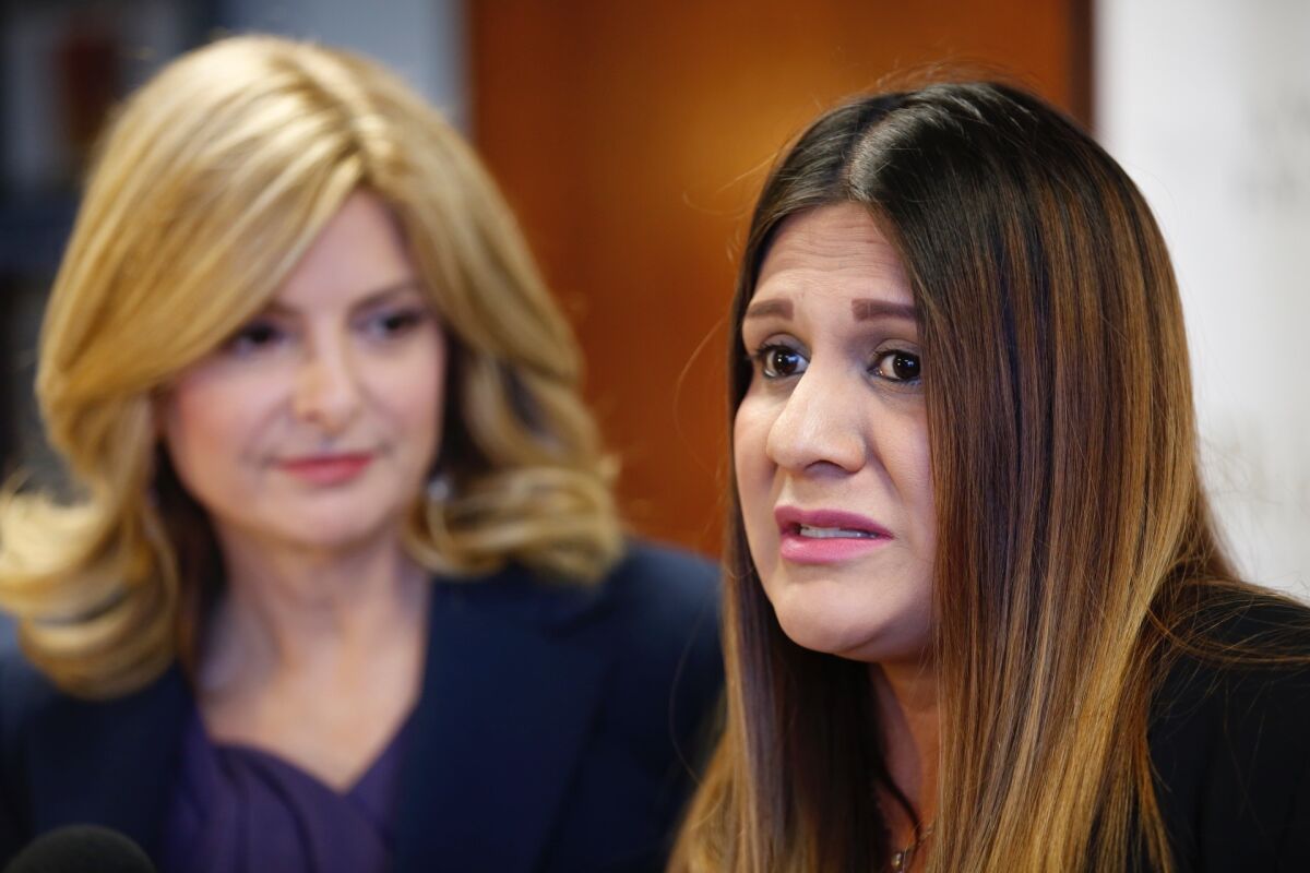 Monica Ochoa, right, a Lynwood city employee with her attorney, Lisa Bloom, speaks at a news conference to discuss her allegations of sexual harassment against City Councilman Edwin Hernandez.