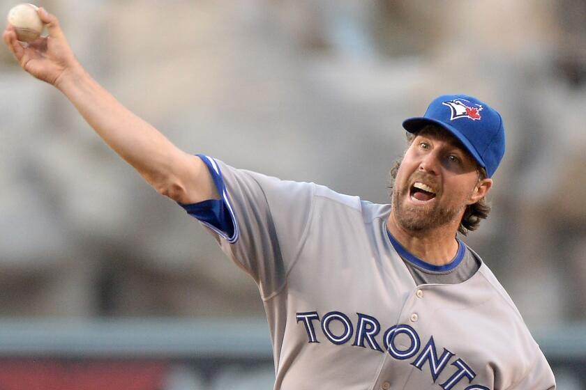 Toronto Blue Jays starter R.A. Dickey allowed four hits and struck out five over seven innings against the Angels to earn his seventh win of the season.