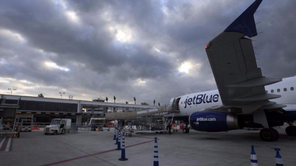 A JetBlue flight from Las Vegas arrives at Long Beach. The airport hopes to cut curfew violations by increasing fines by as much as 3,200%.