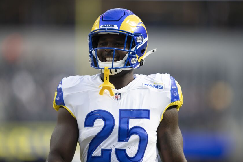 Los Angeles Rams running back Sony Michel (25) smiles as he warms up before an NFL football game against the Chicago Bears Sunday, Sept. 12, 2021, in Inglewood, Calif. (AP Photo/Kyusung Gong)