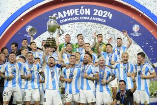 Players of Argentina celebrate with the trophy after defeating Colombia in the Copa America.
