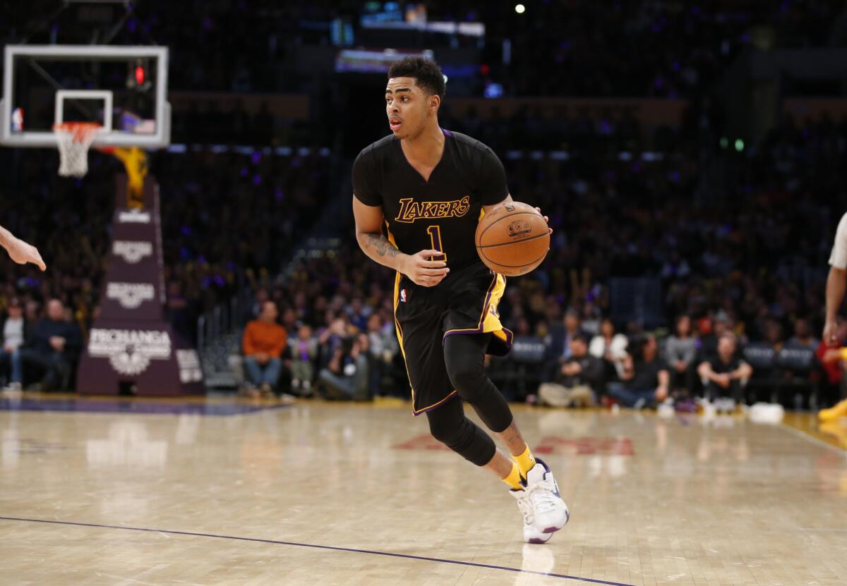 D'Angelo Russell dribbles the ball against the Philadelphia 76ers during a Jan. 1 game at Staples Center.