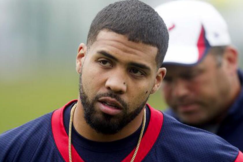 Houston Texans running back Arian Foster walks to practice during minicamp in Houston on May 27, 2014.