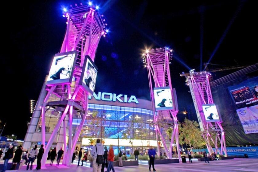 Moving images on video screens in front of the Nokia Theatre in downtown L.A. draw eyes away from the buildings.