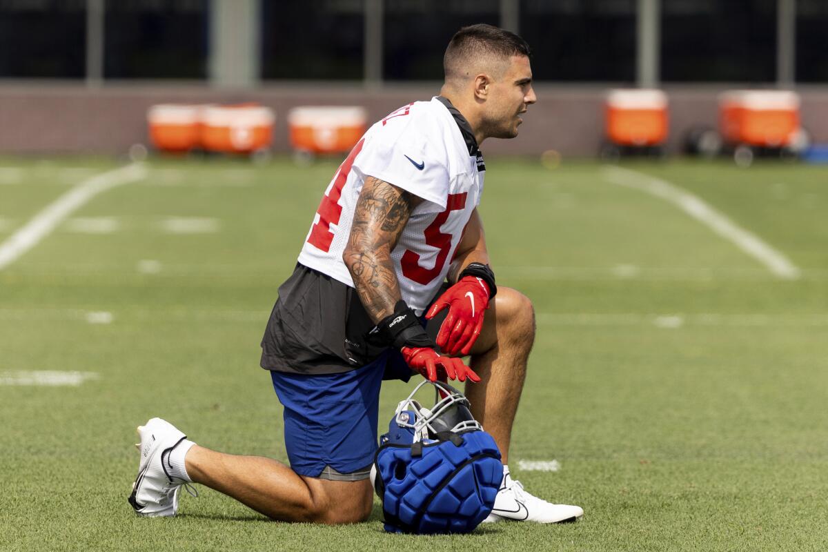 FILE - New York Giants linebacker Blake Martinez watches during the NFL football team's training camp in East Rutherford, N.J., on July 28, 2022. The Giants have released Martinez, Thursday, Sept. 1, 2022, less than a year after the veteran and former defensive captain sustained a torn ACL. (AP Photo/Julia Nikhinson, File)