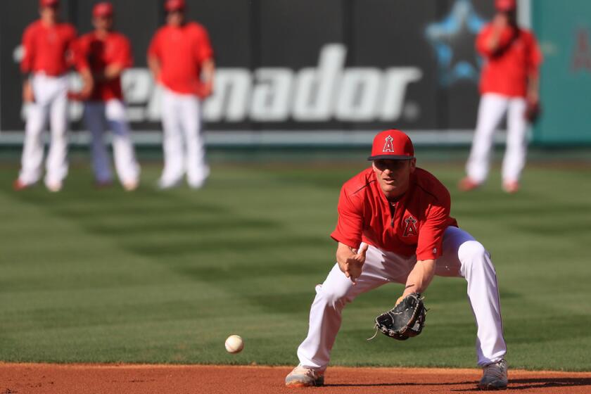 Angels' Brendan Ryan warms up prior to a game against the St. Louis Cardinals at Angel Stadium on Tuesday.