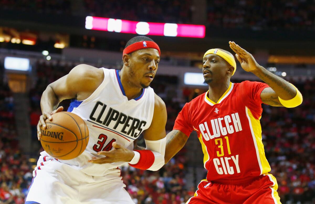 The Clippers' Paul Pierce takes on Houston's Jason Terry on Wednesday night.