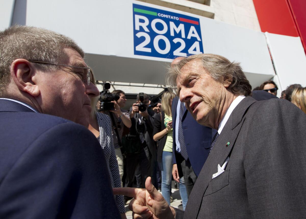 International Olympic Committee President Thomas Bach, left, is greeted by the head of the Rome 2024 Olympic Bid Committee Luca Cordero di Montezemolo on May 22.