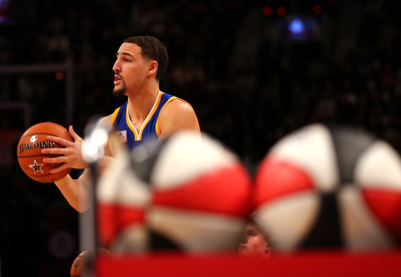 Golden State guard Klay Thompson takes aim during the Foot Locker Three-Point Contest on Saturday night.