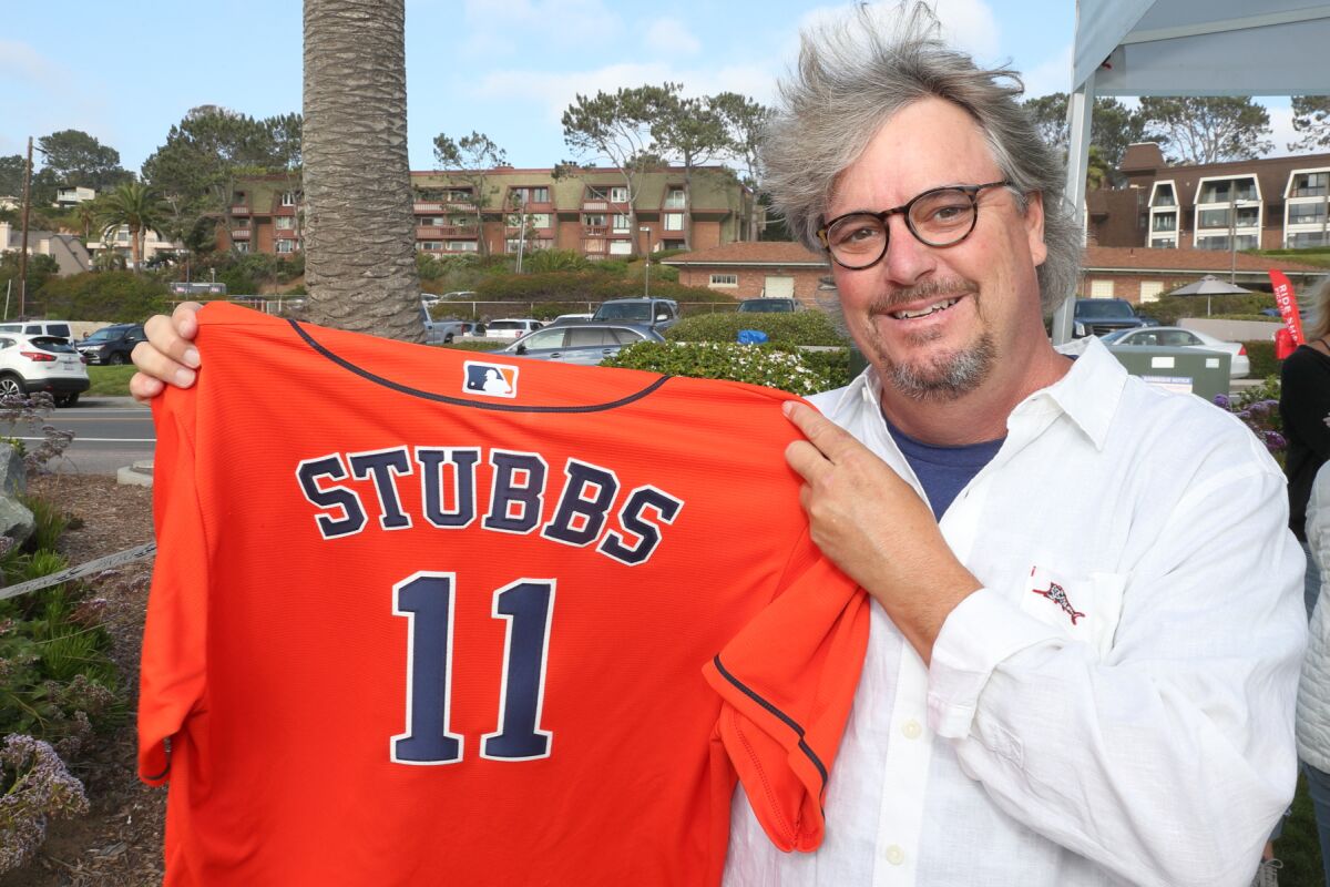 T. Pat Stubbs with his son's Houston Astros jersey
