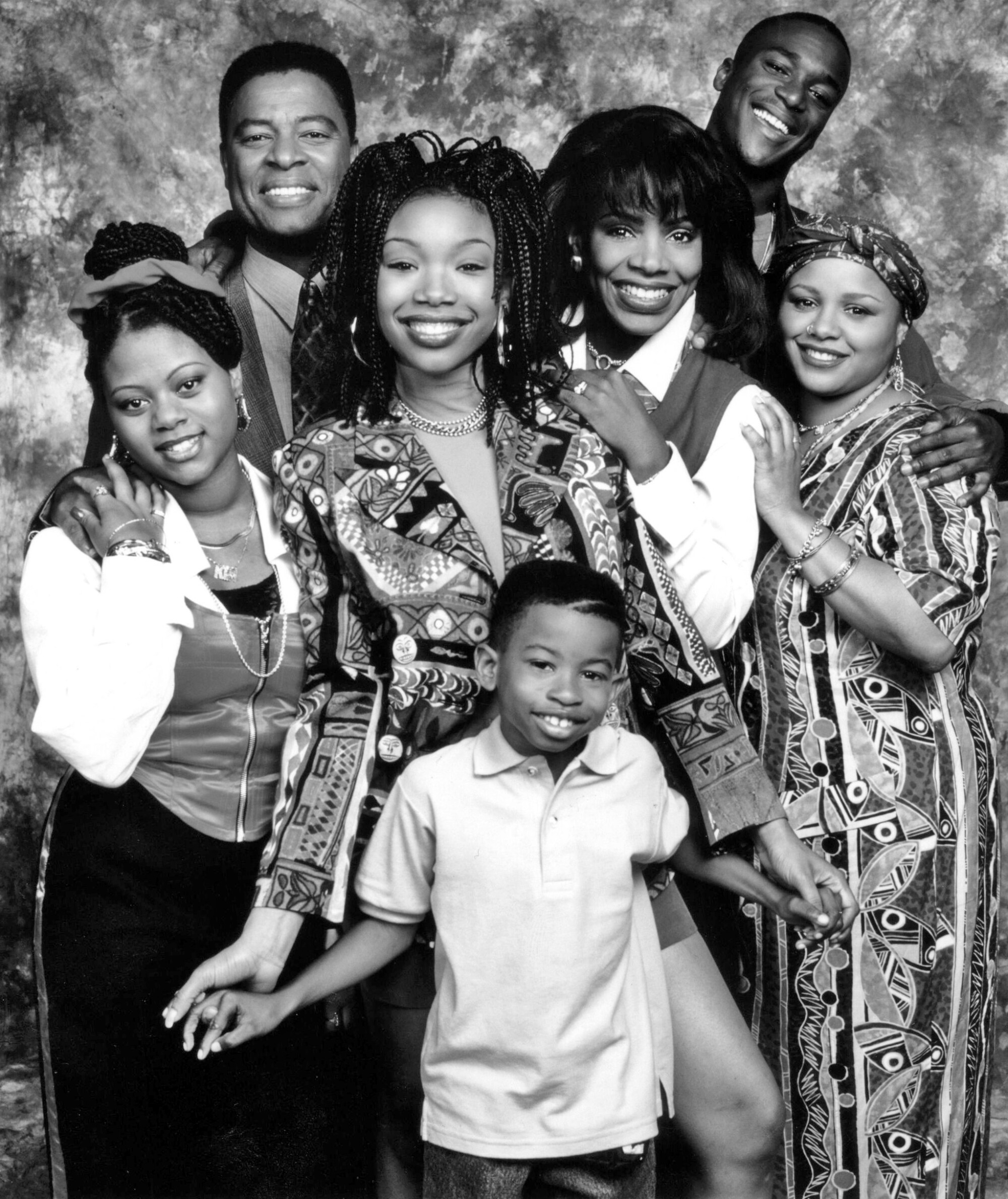 The cast for TV show "Moesha" in 1995, a smiling group of people of varying ages