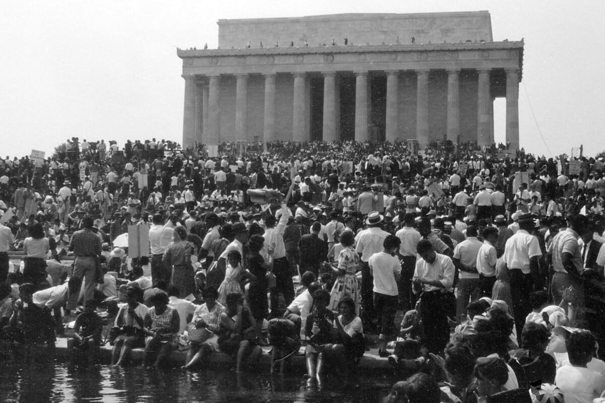 Crowds gathered in front of the Lincoln Memorial in Washington, D.C., in black and white photo