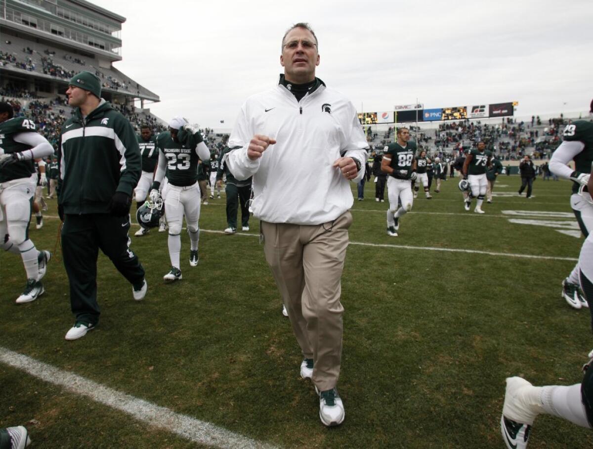 Michigan State defensive coordinator Pat Narduzzi, above, wants someone to step up and fill the shoes of the suspended Max Bullough.
