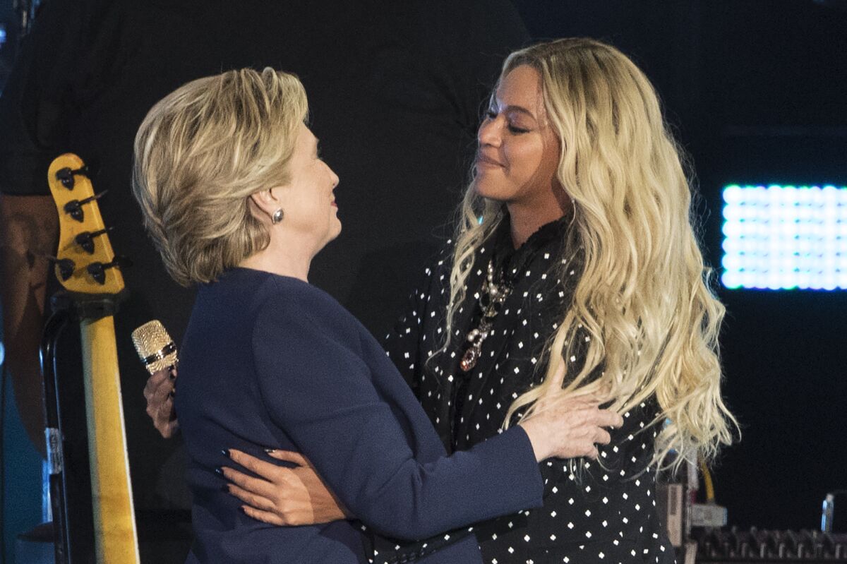 Hillary Clinton and Beyoncé embrace during a campaign rally in Cleveland on Nov. 4.