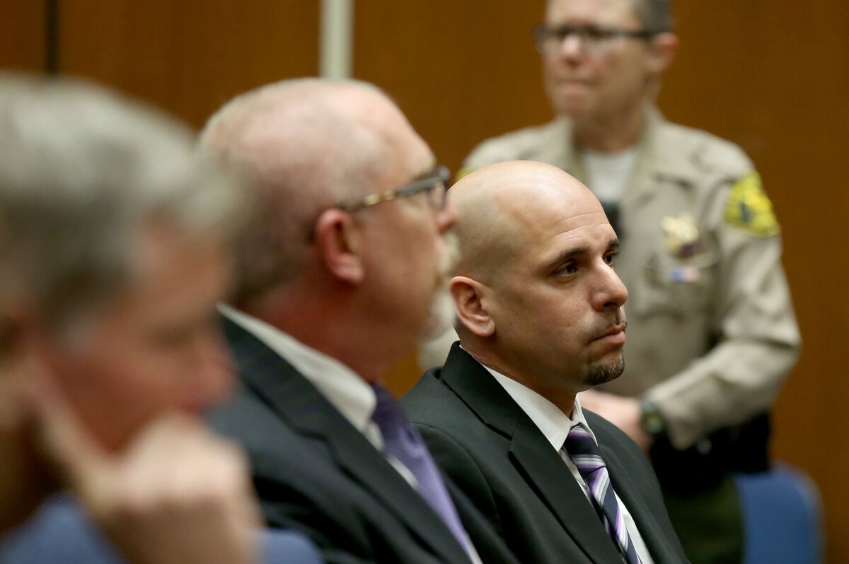 Raymond Lee Jennings, right, attends a hearing in Los Angeles. (Luis Sinco / Los Angeles Times)