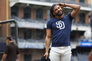 San Diego, CA - April 17: San Diego Padres' Fernando Tatis Jr. laughs while stretching during batting practice before a game against the Atlanta Braves at Petco Park on Monday, April 17, 2023. (K.C. Alfred / The San Diego Union-Tribune)