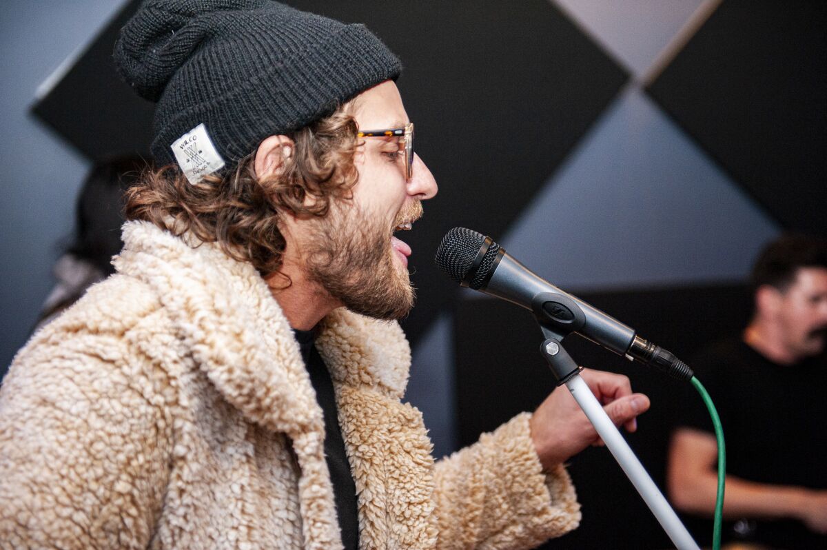 Michael Lakis, aka Microphone Jones, sings in a fur coat.