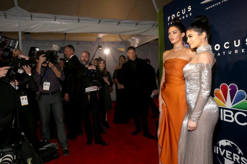 Kendall Jenner, left, and sister Kylie Jenner attend parties after the Golden Globes on Sunday.