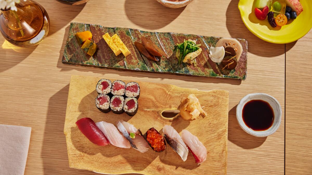 Sushi Set nigiri and sushi rolls on rectangular wooden plates