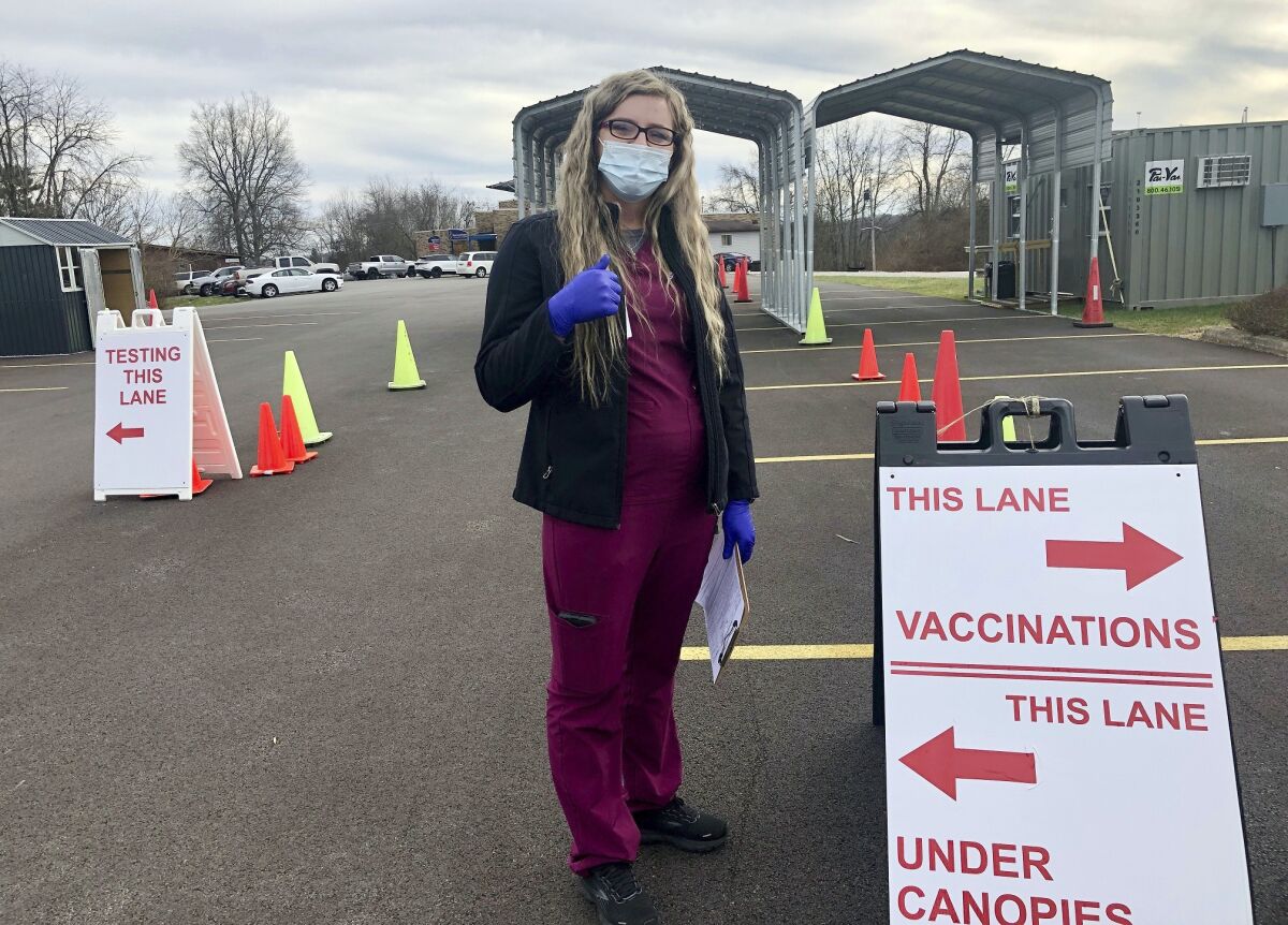 Nurse Chania Batten waits to administer COVID-19 vaccines at a drive-thru clinic in Spencer, W.Va.
