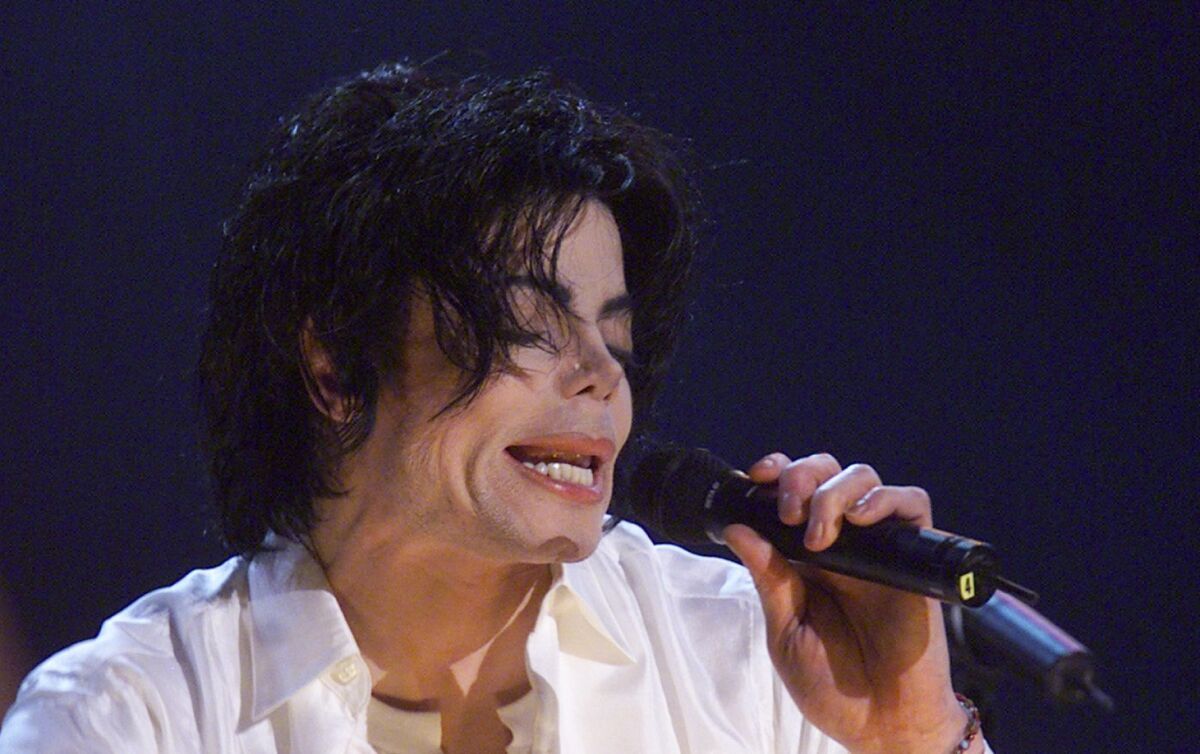 in this 2001 file photo, Michael Jackson performs during his "30th Anniversary Celebration, The Solo Years" concert at New York's Madison Square Garden.