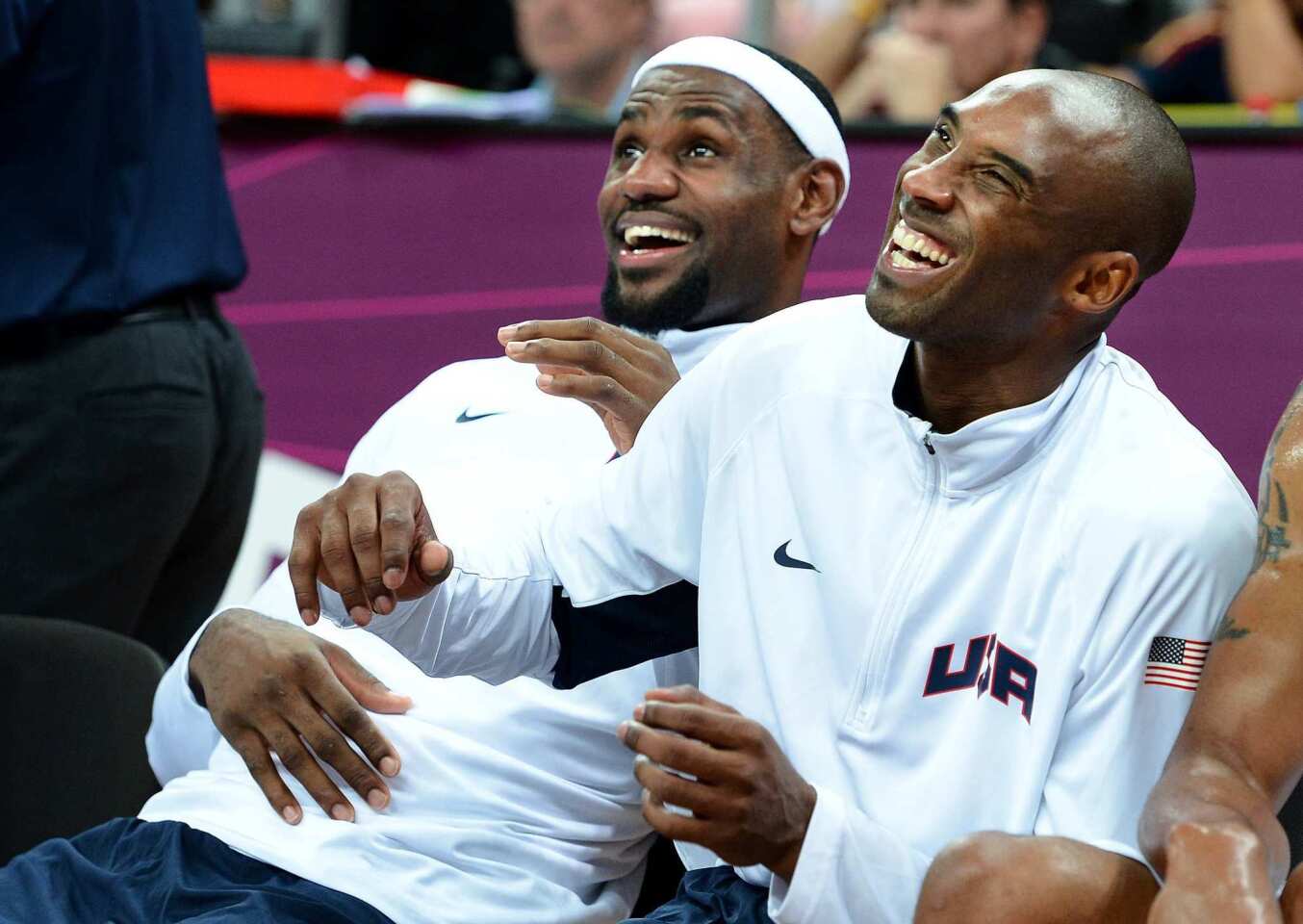 LeBron James and Kobe Bryant of the United States' basketball squad relax on the bench during a blowout against Nigeria.